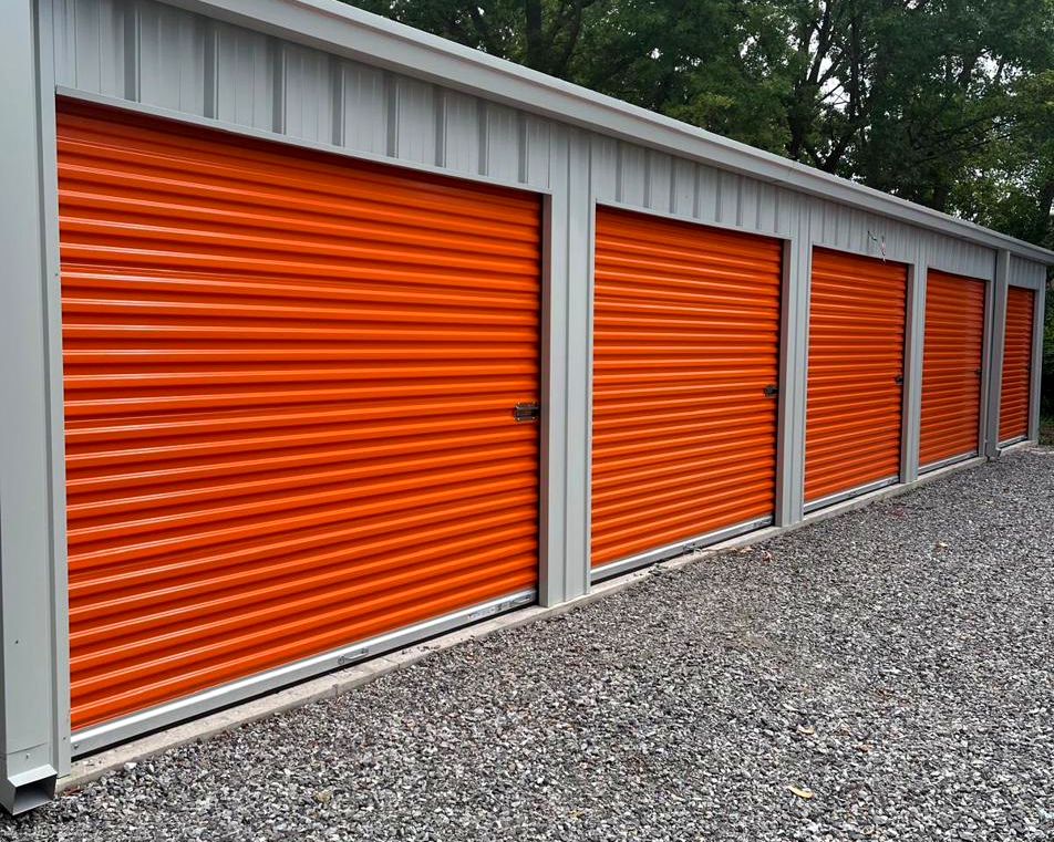 Ground-level drive-up self storage units with wide asphalt lanes at HJ Storage in Niagara Falls